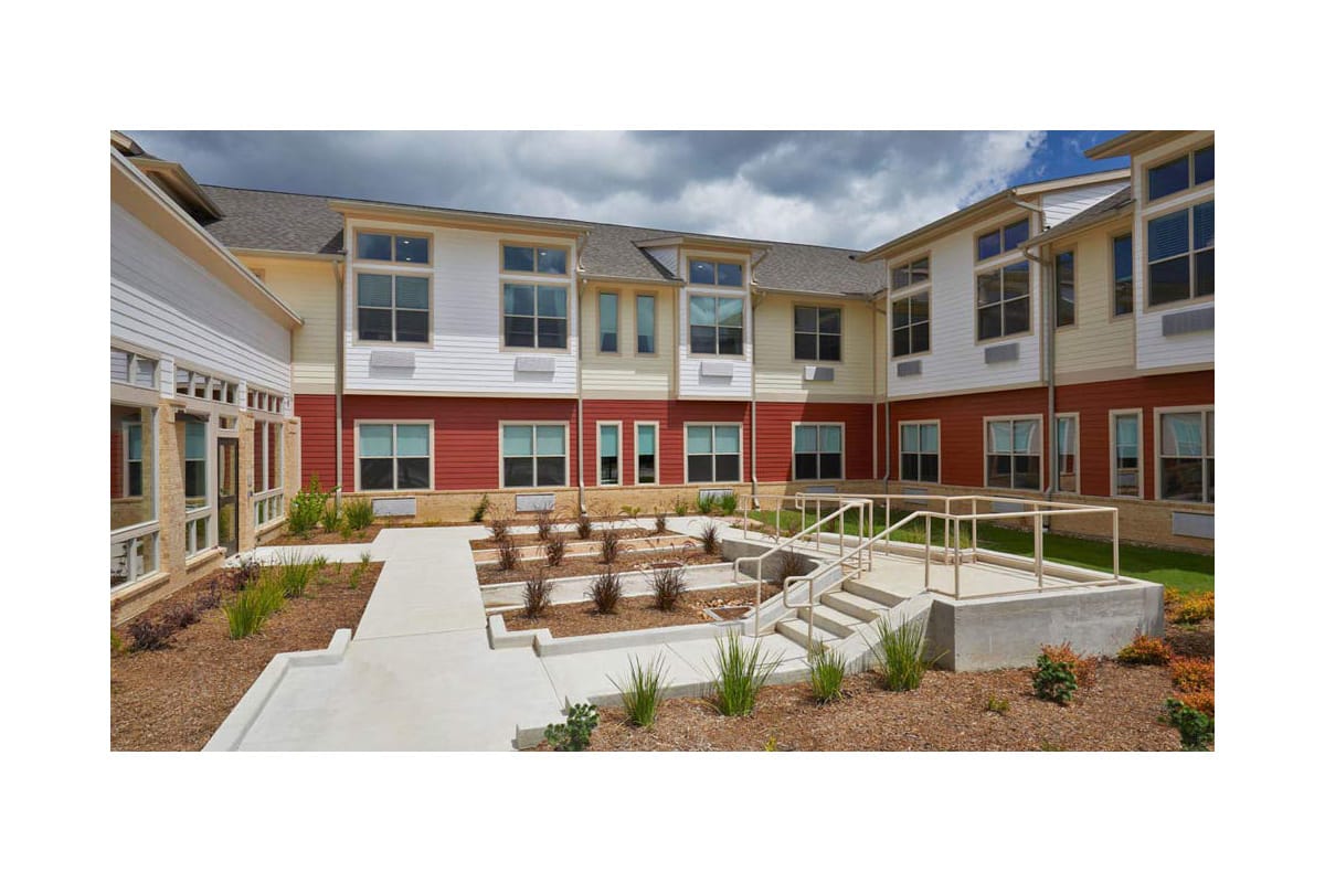 Outdoor garden space with seating and landscaping elements