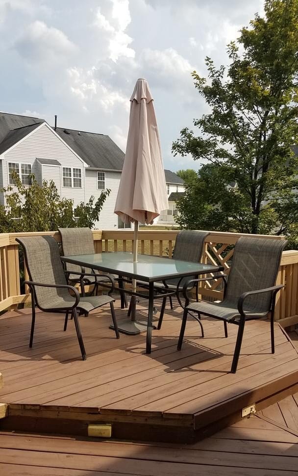 Outdoor seating area with a table and umbrellas
