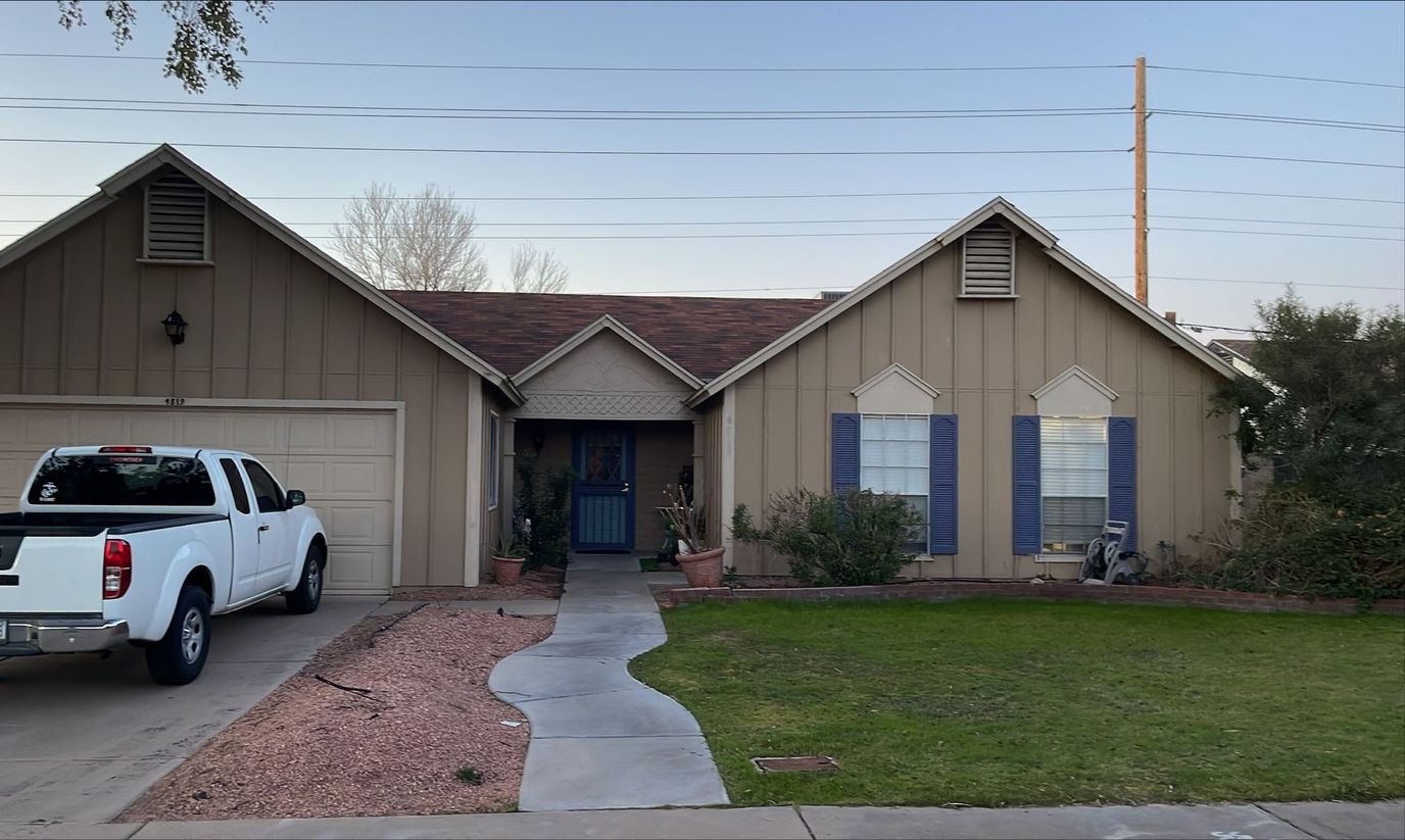 Exterior view of a senior living facility with a vehicle