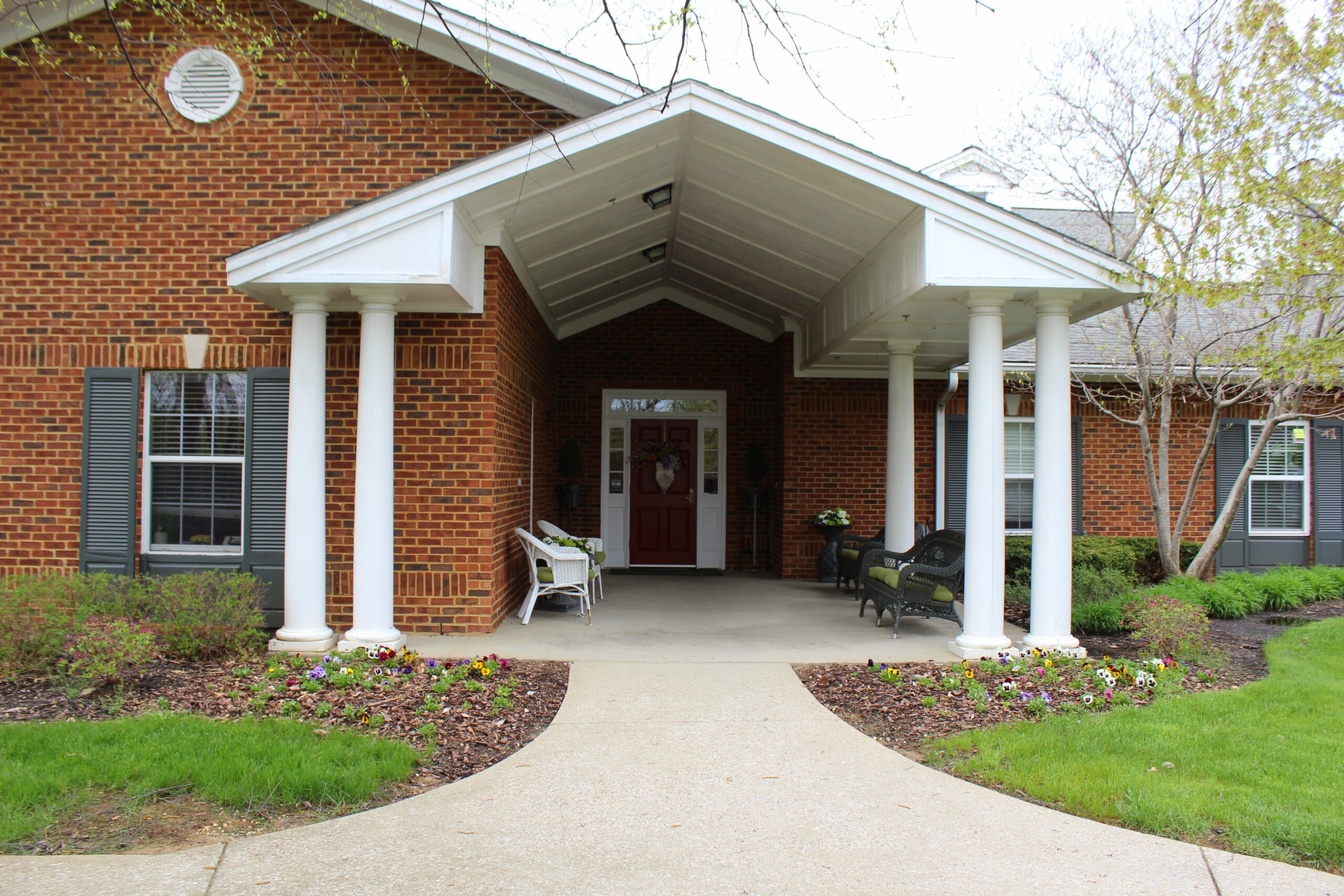 Exterior entrance view of Barton House with landscaping