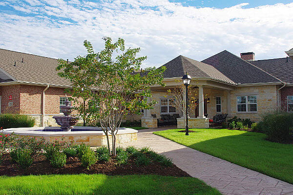 Exterior view of a nursing home with landscaping