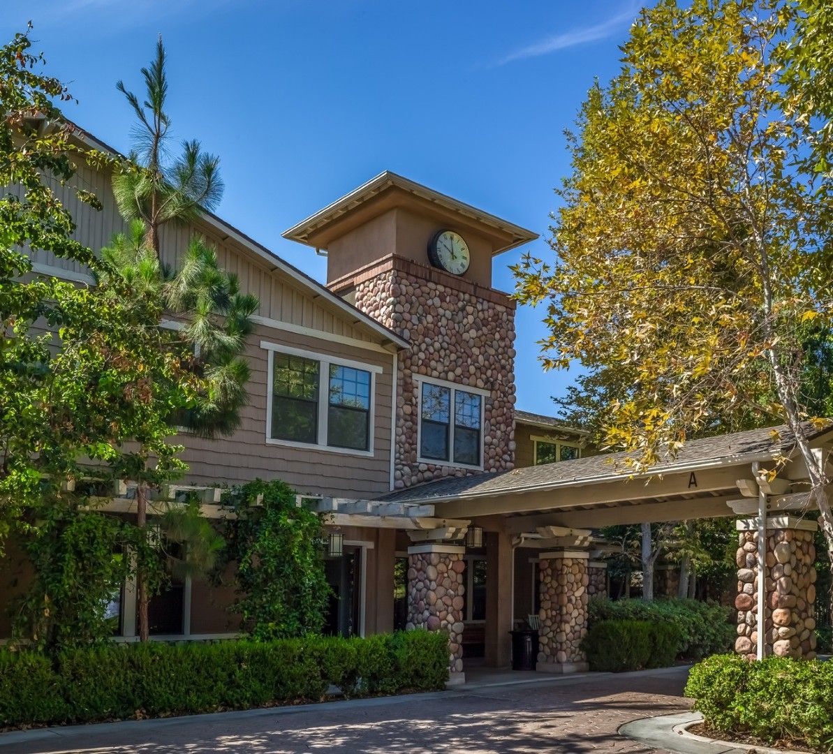 Exterior view of a senior housing facility with landscaping