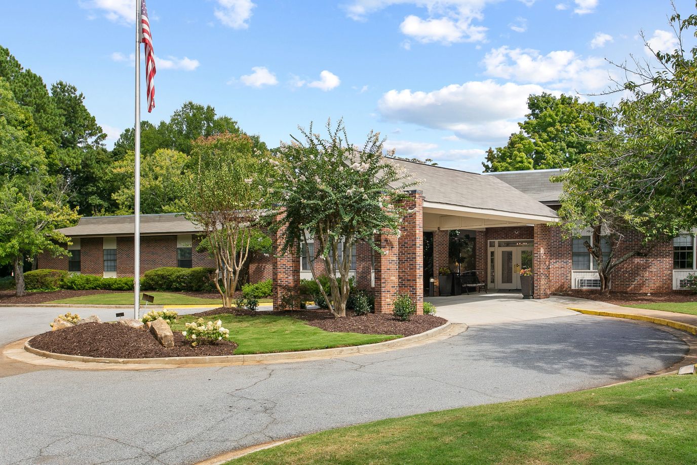 Entrance view of Mt Vernon Village with landscaping