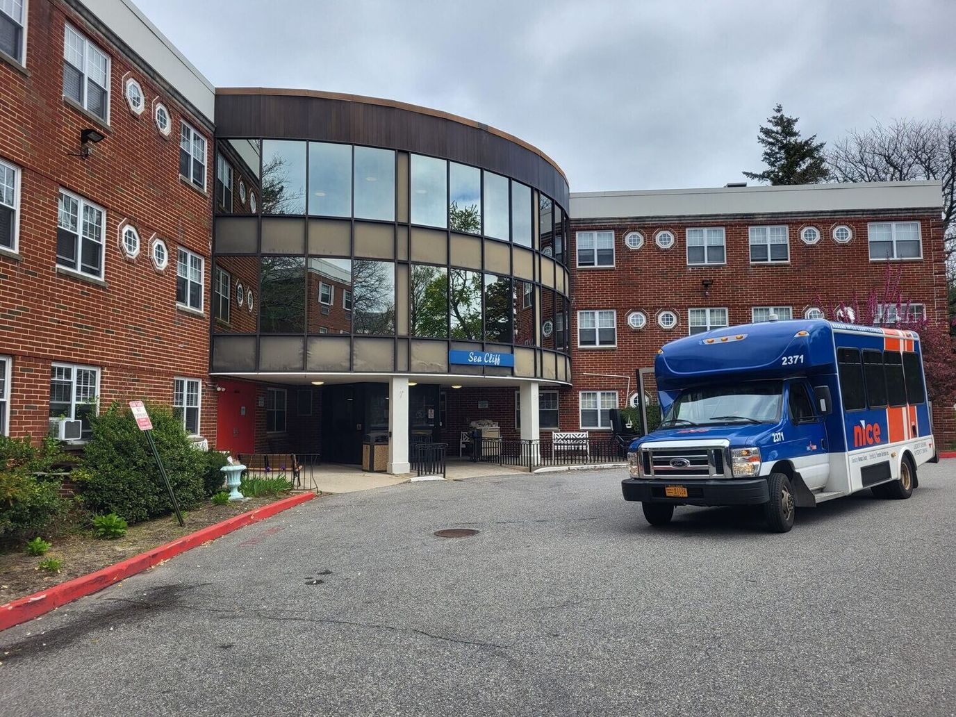 Facility building entrance with transportation vehicle