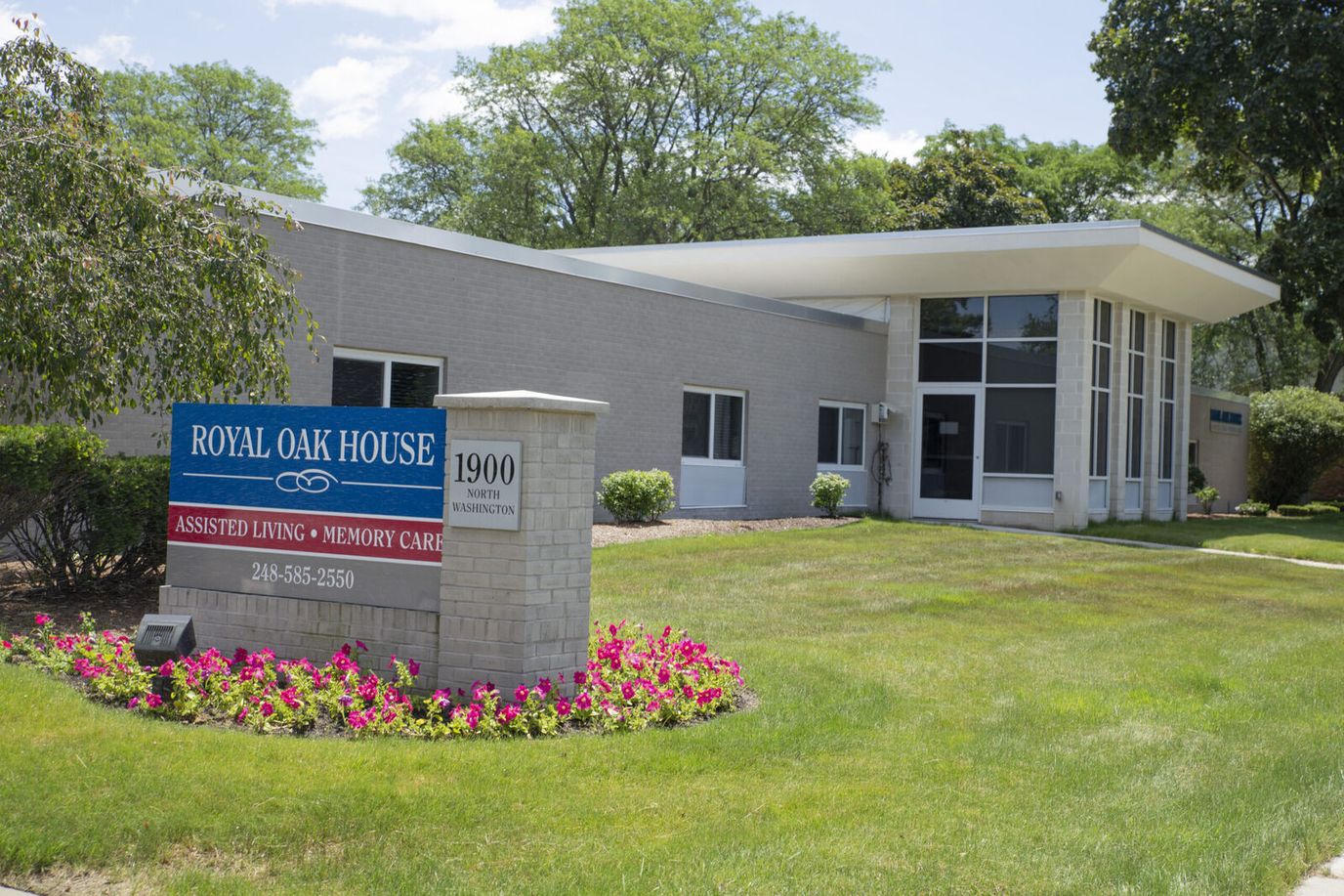 Exterior view of Royal Oak House with sign and landscaping