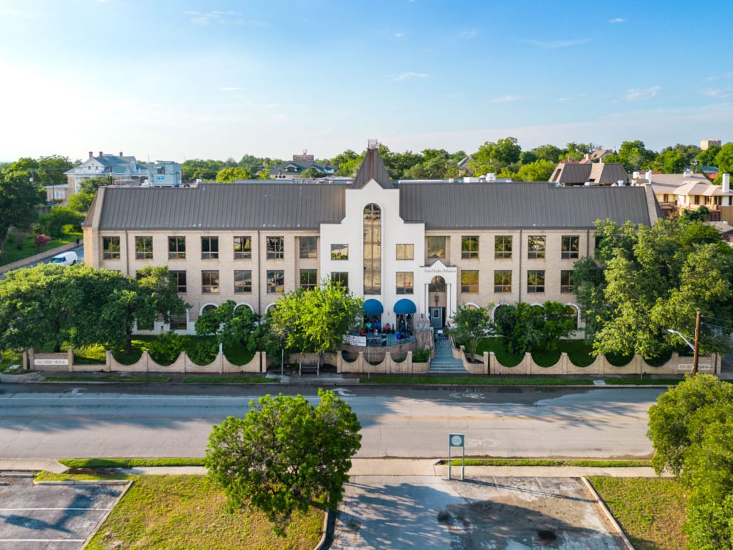 Aerial view of San Pedro Manor building and outdoor area.