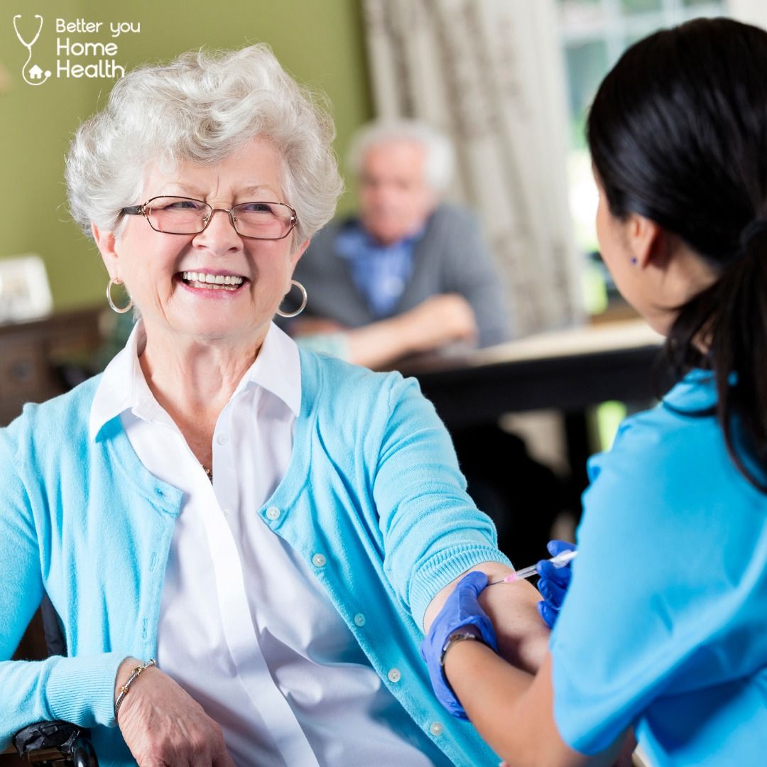 A caregiver taking a resident's blood pressure