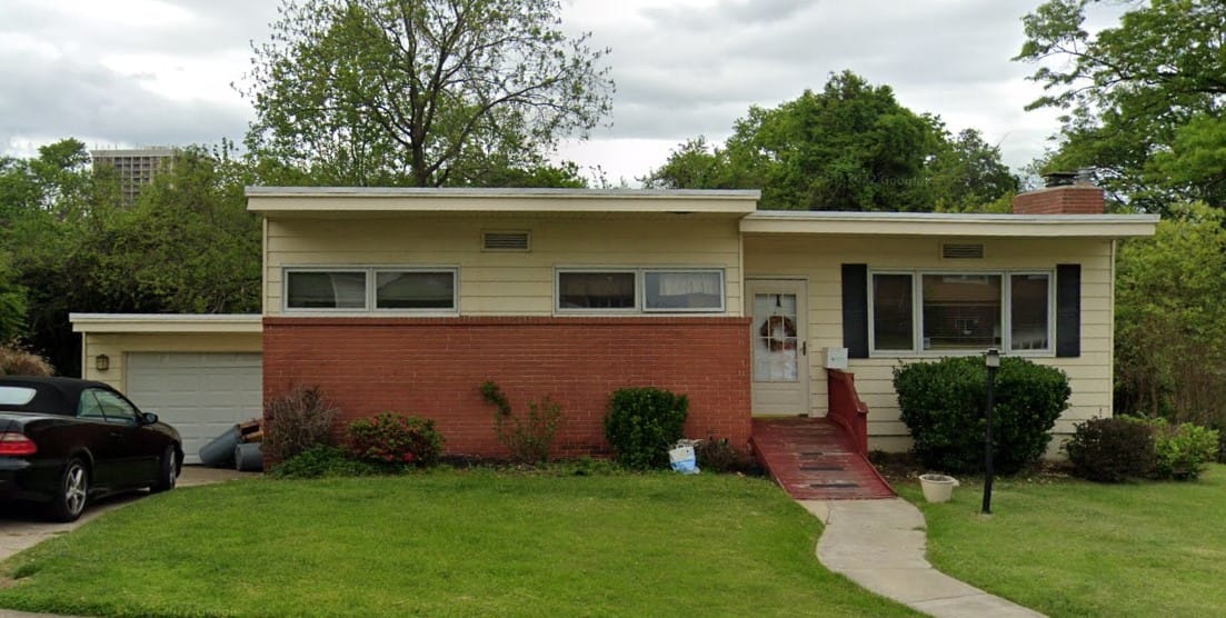 Exterior view of a single-story facility with green lawn