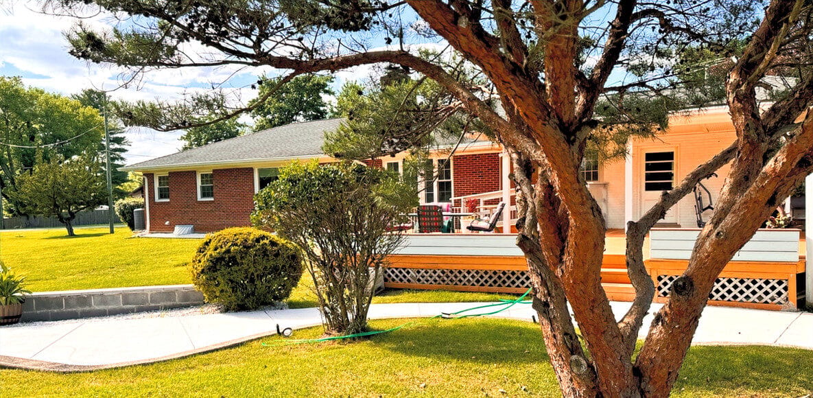 Exterior view of CareVilla Briggs Chaney building with garden