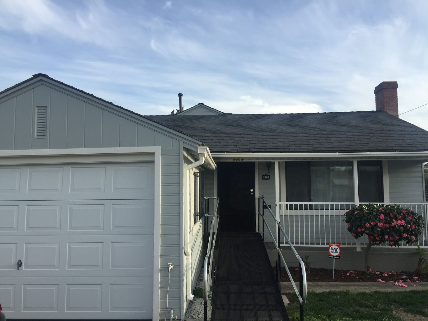 Exterior view of a single-story home with a ramp