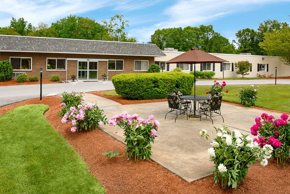 Beautiful outdoor seating area with flowers and trees