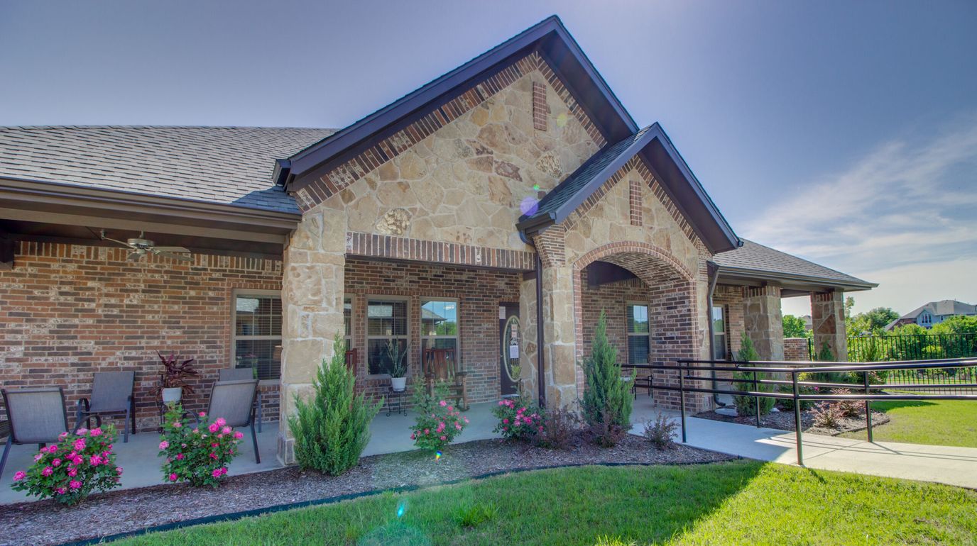 Exterior view of Mayberry Gardens with landscaped entrance