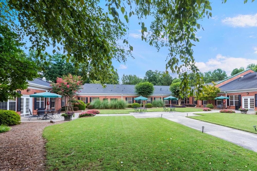 Outdoor space with well-maintained gardens and seating