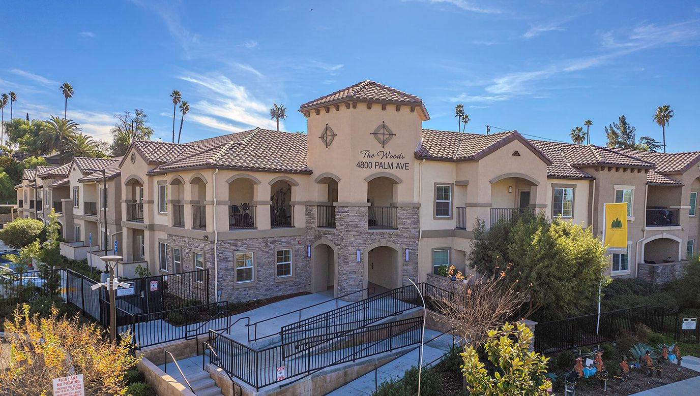 Exterior view of The Woods Senior Living facility