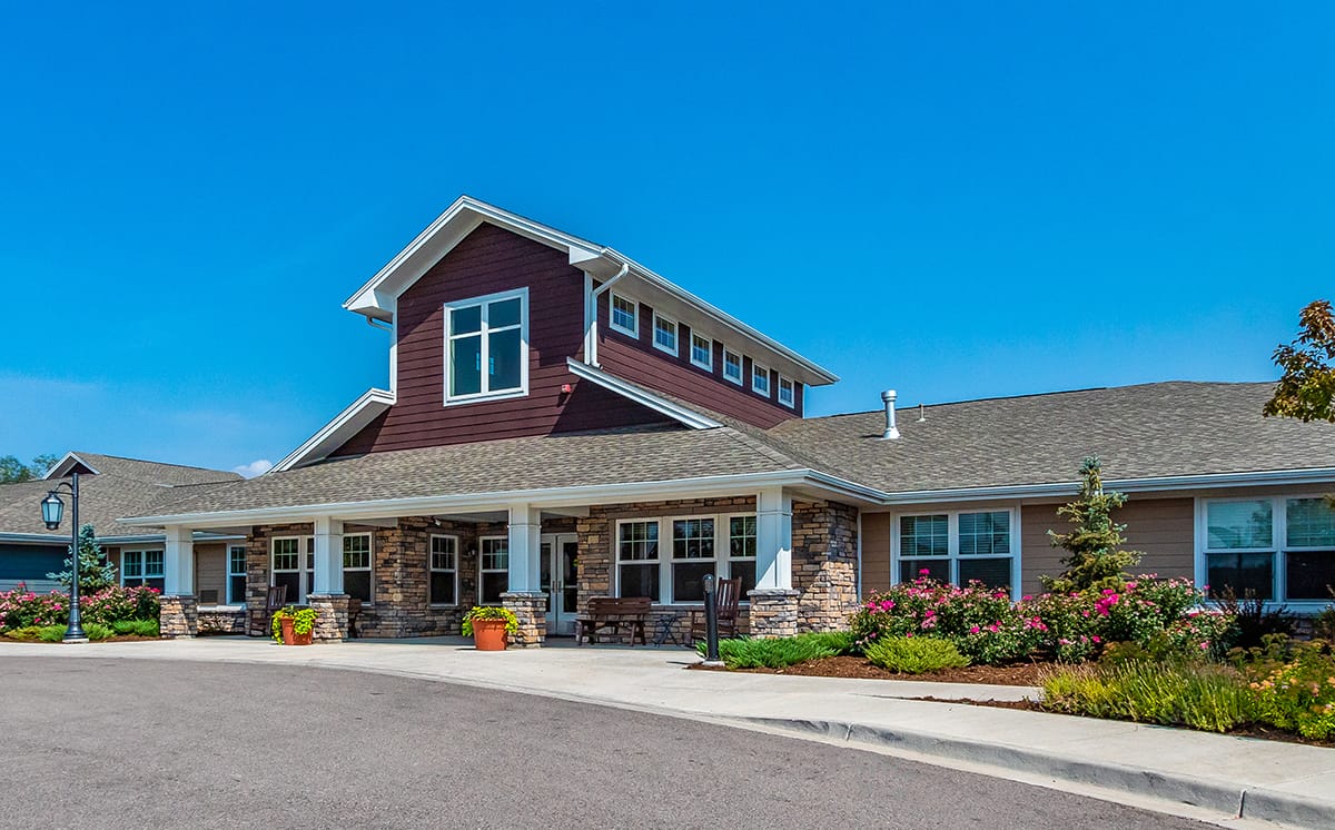 Exterior view of assisted living facility with landscaping