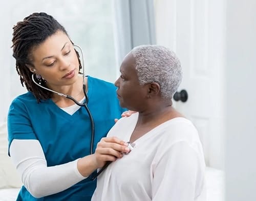 Elder Care Homecare – New York, home care agencie in New York, NY — Nurse checking elderly woman's heartbeat with a stethoscope