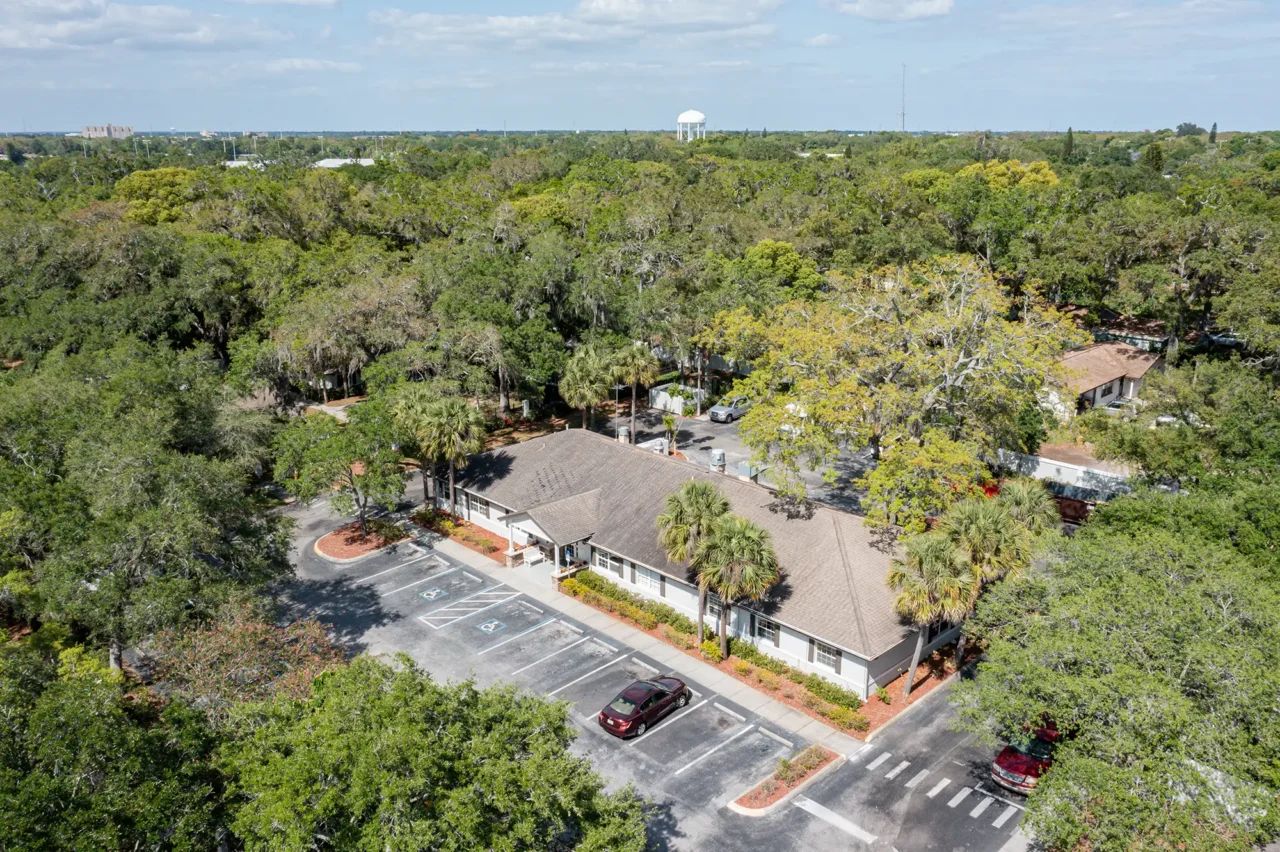 Aerial view of the facility surrounded by greenery