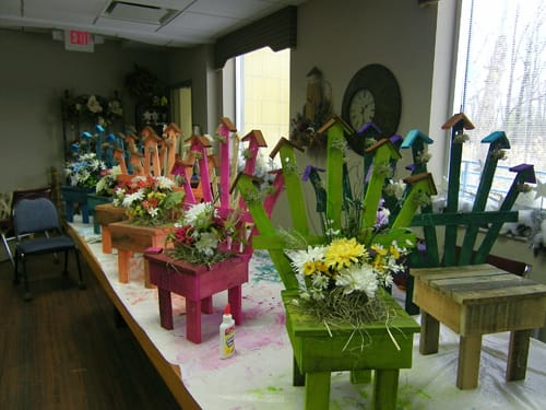 Colorful flower arrangements on a table in an activity room