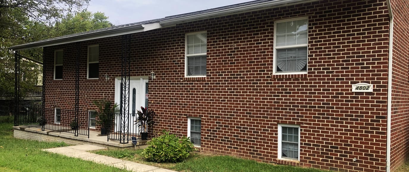 Exterior view of a brick building with entrance