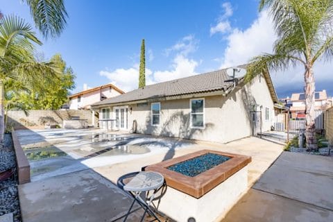 Outdoor space with pool and seating area