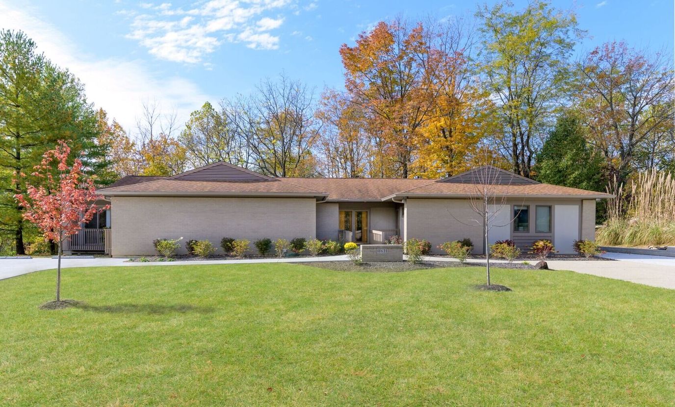 Exterior view of Mimi's House surrounded by trees