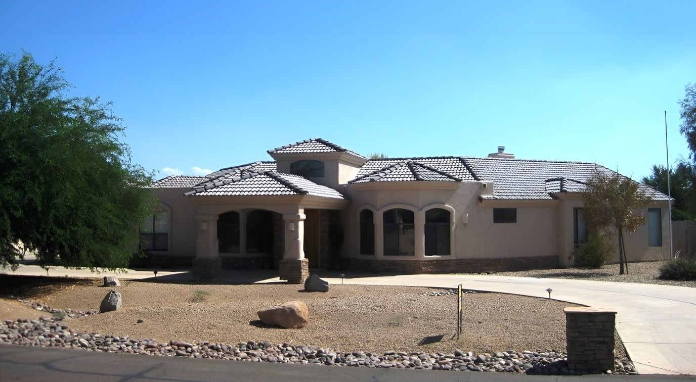 Exterior view of a senior living facility with landscaping