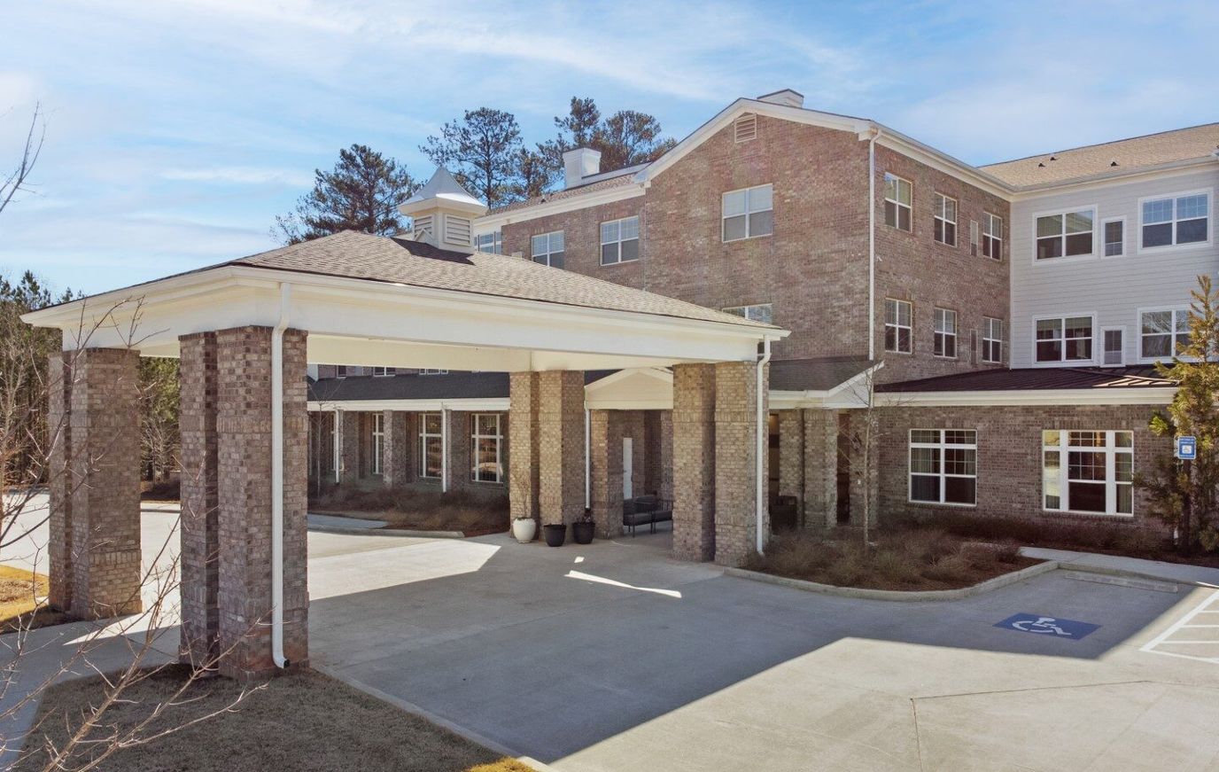 Entrance of a senior living facility under a covered portico