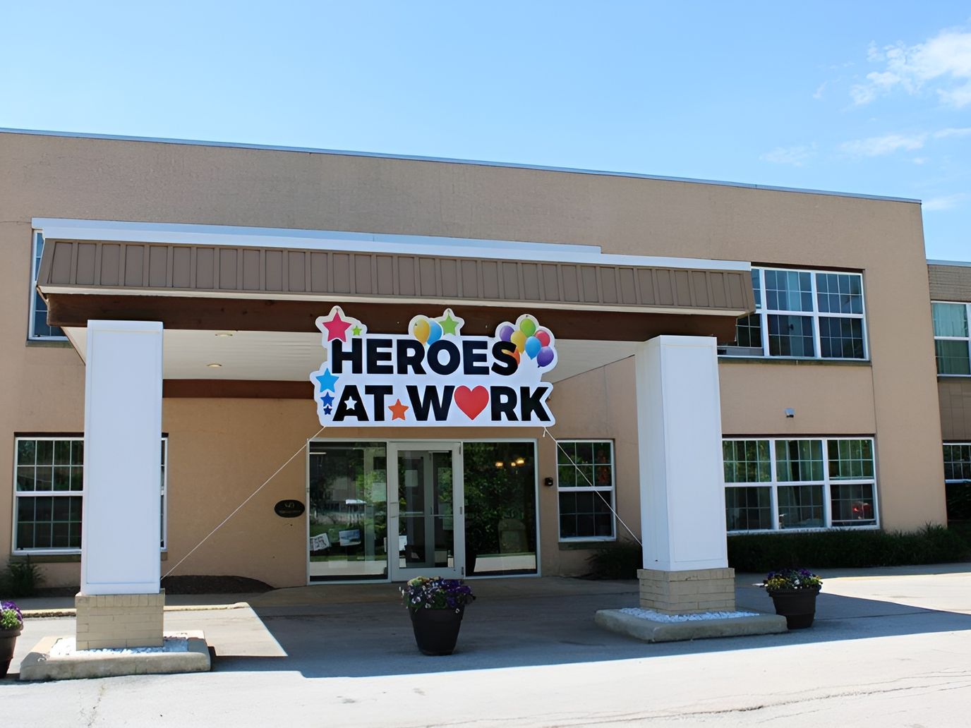 Exterior view of the facility with a colorful sign