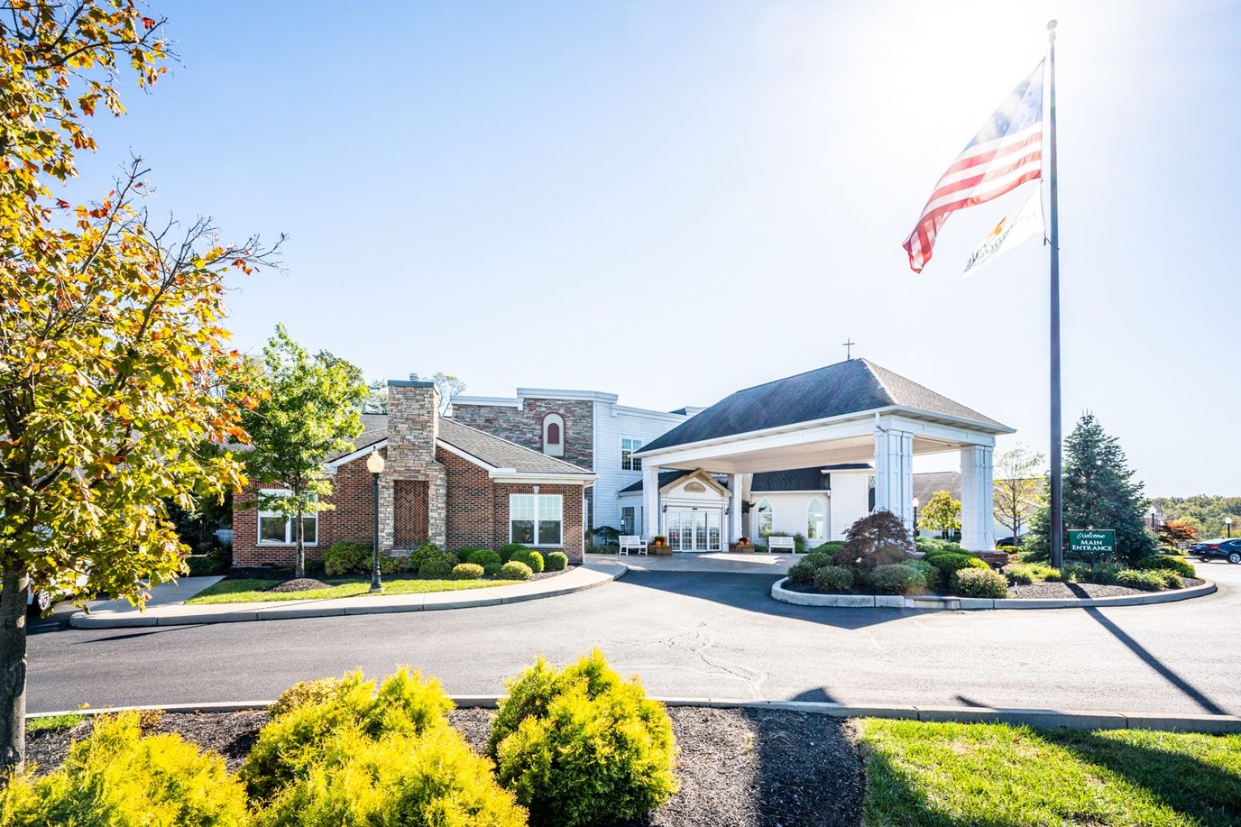 Entrance of Doverwood Skilled Nursing Facility with American flag