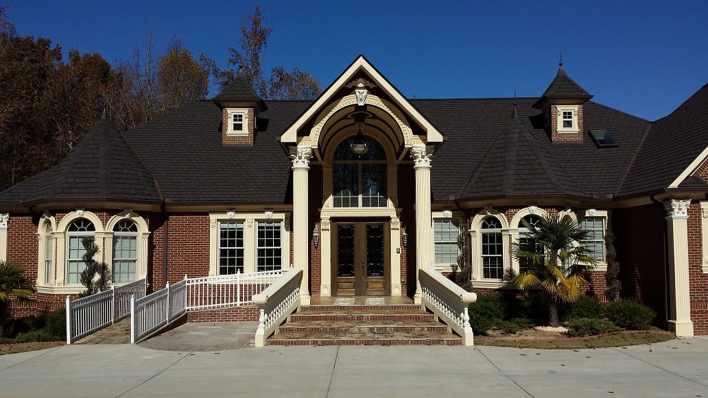 Exterior view of a large brick building with a grand entrance