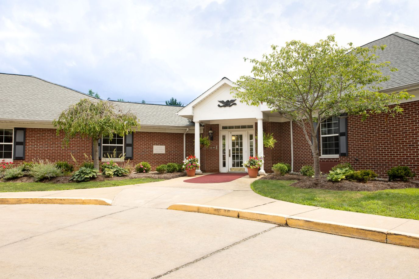 Front entrance of Governor's Pointe with landscaped surroundings