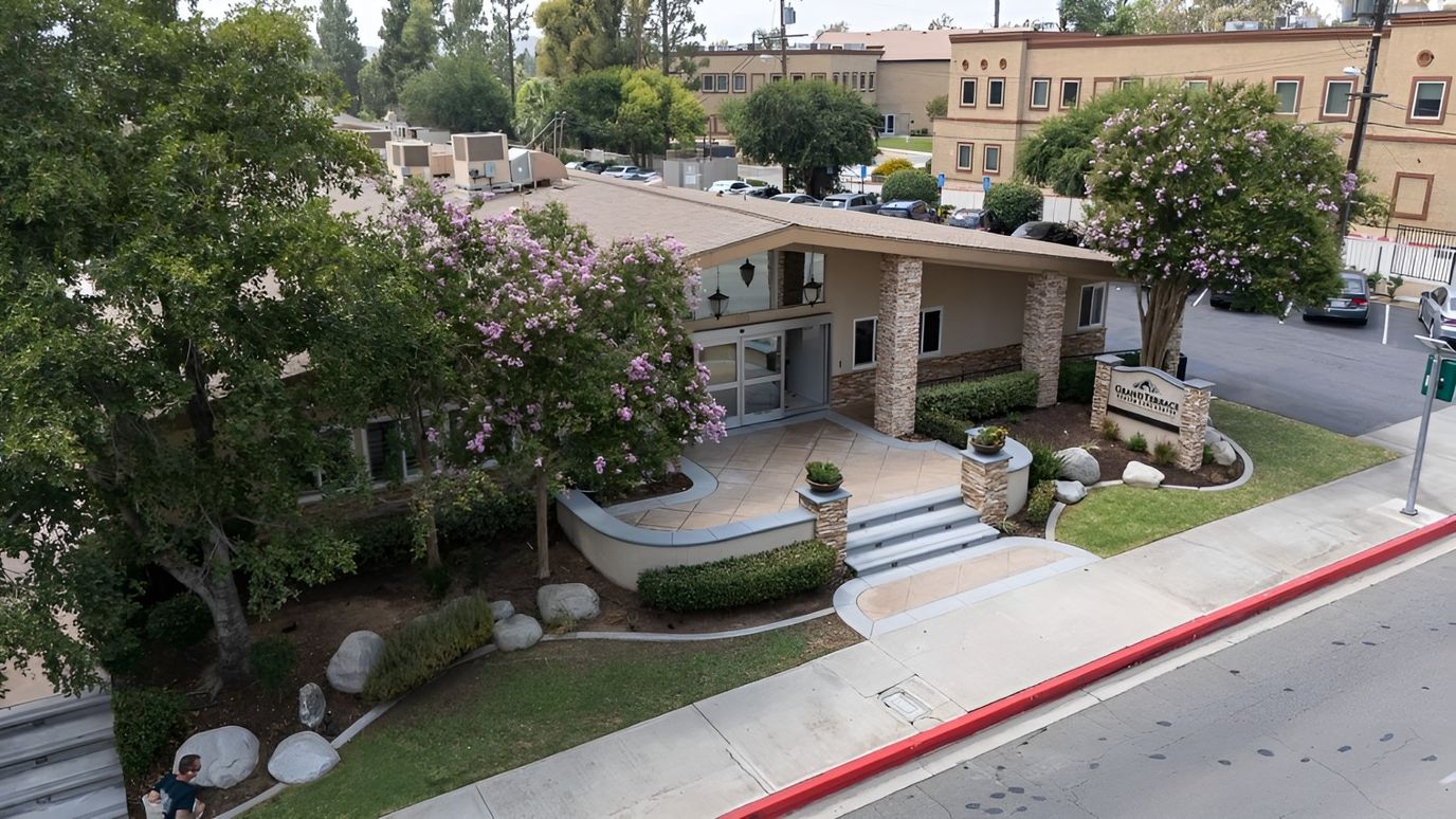 Front exterior of Grand Terrace Health Care Center with landscaping