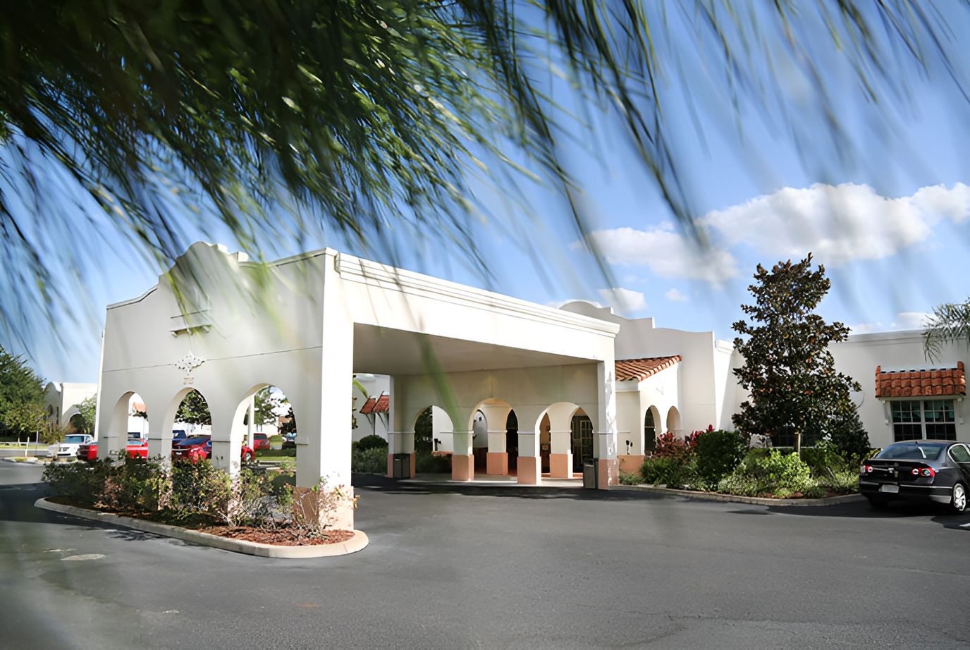 Exterior view of the building entrance with arches