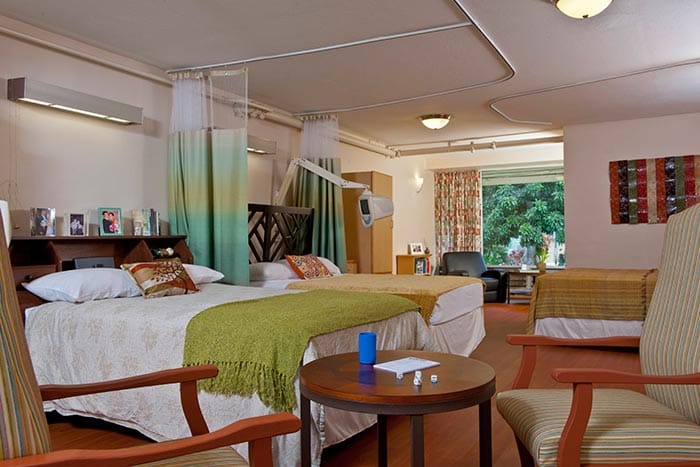 Shared resident room with two beds and personal decor