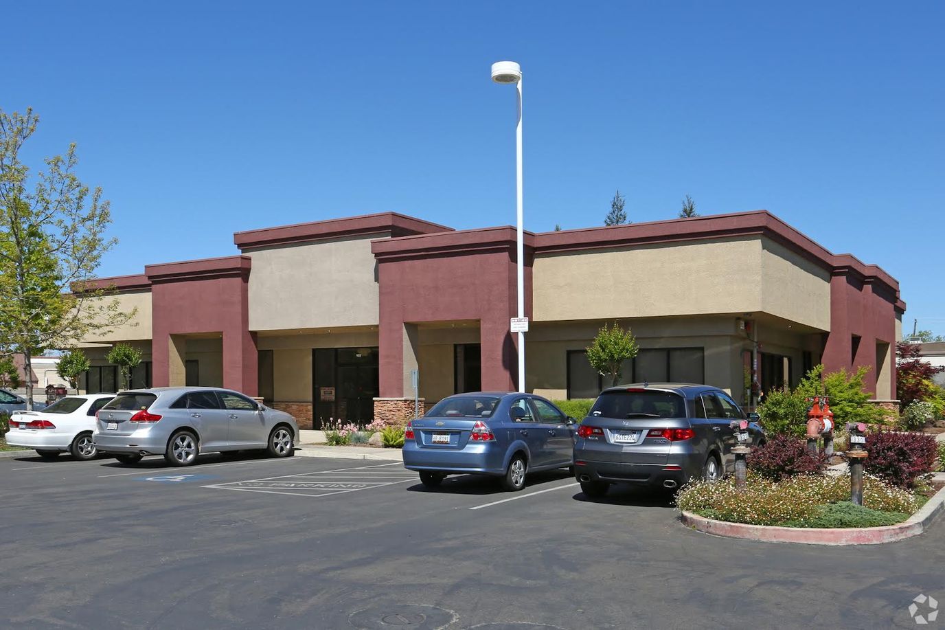 Exterior view of a health facility with parking
