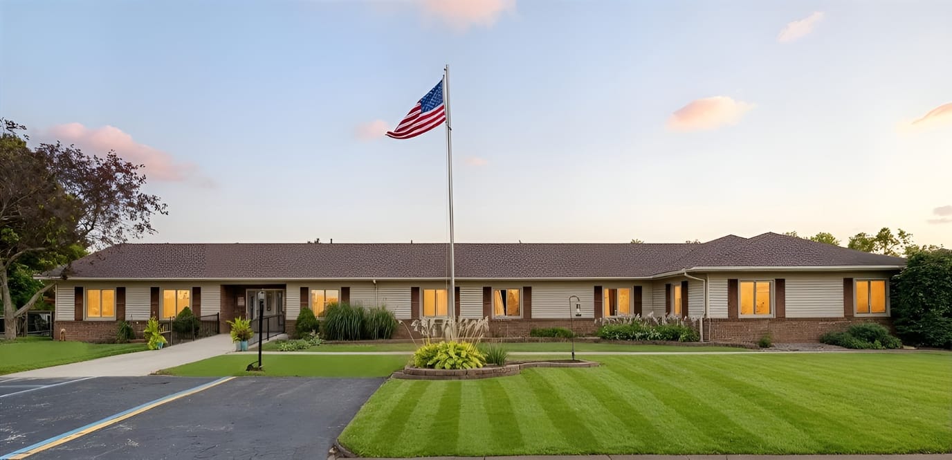 Exterior view of a senior care facility with landscaping