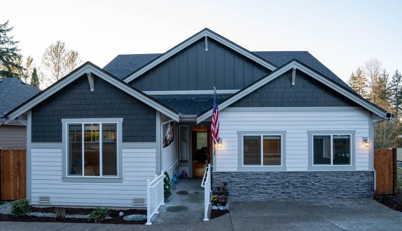 Exterior view of a residential care facility with an American flag