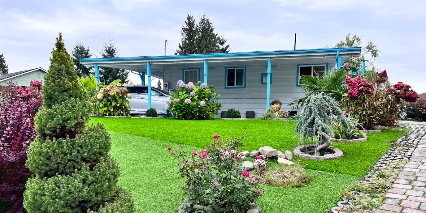 Exterior view of a senior care home with landscaped garden