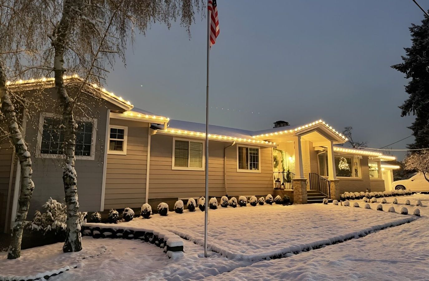 Exterior view of the facility with snow and holiday lights