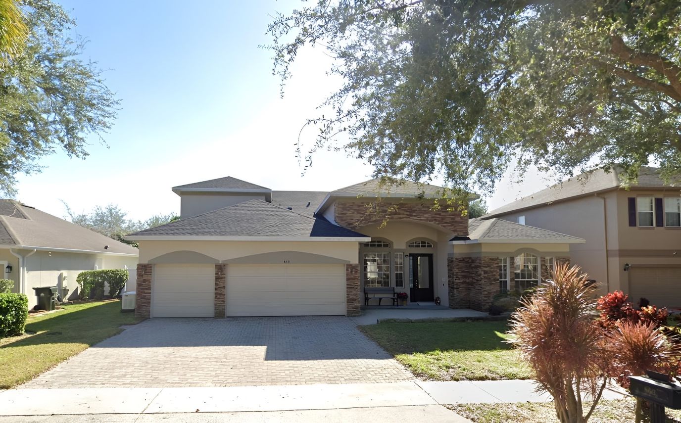 Exterior view of a residential building with front yard