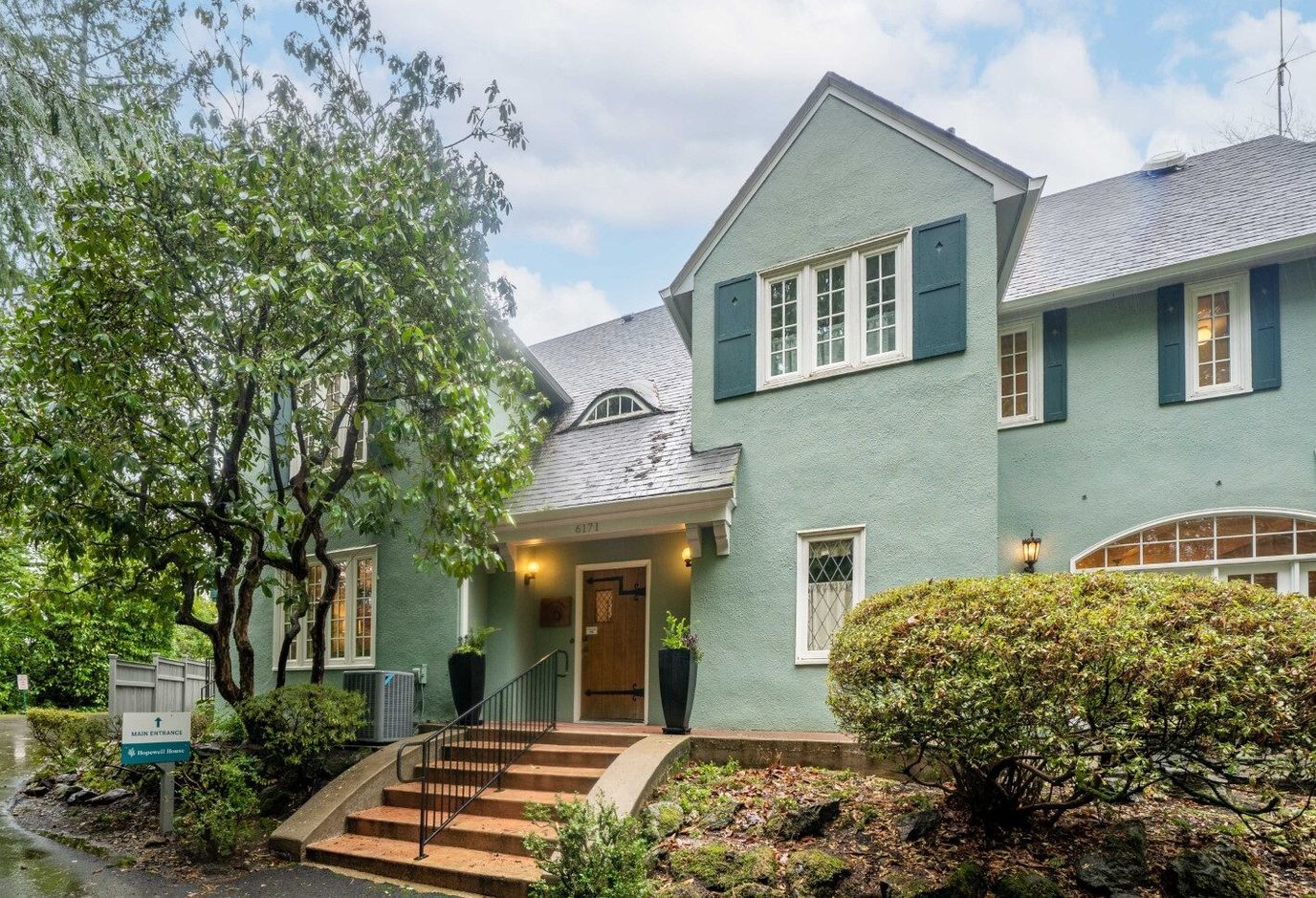 Exterior view of Hopewell House with landscaped entryway