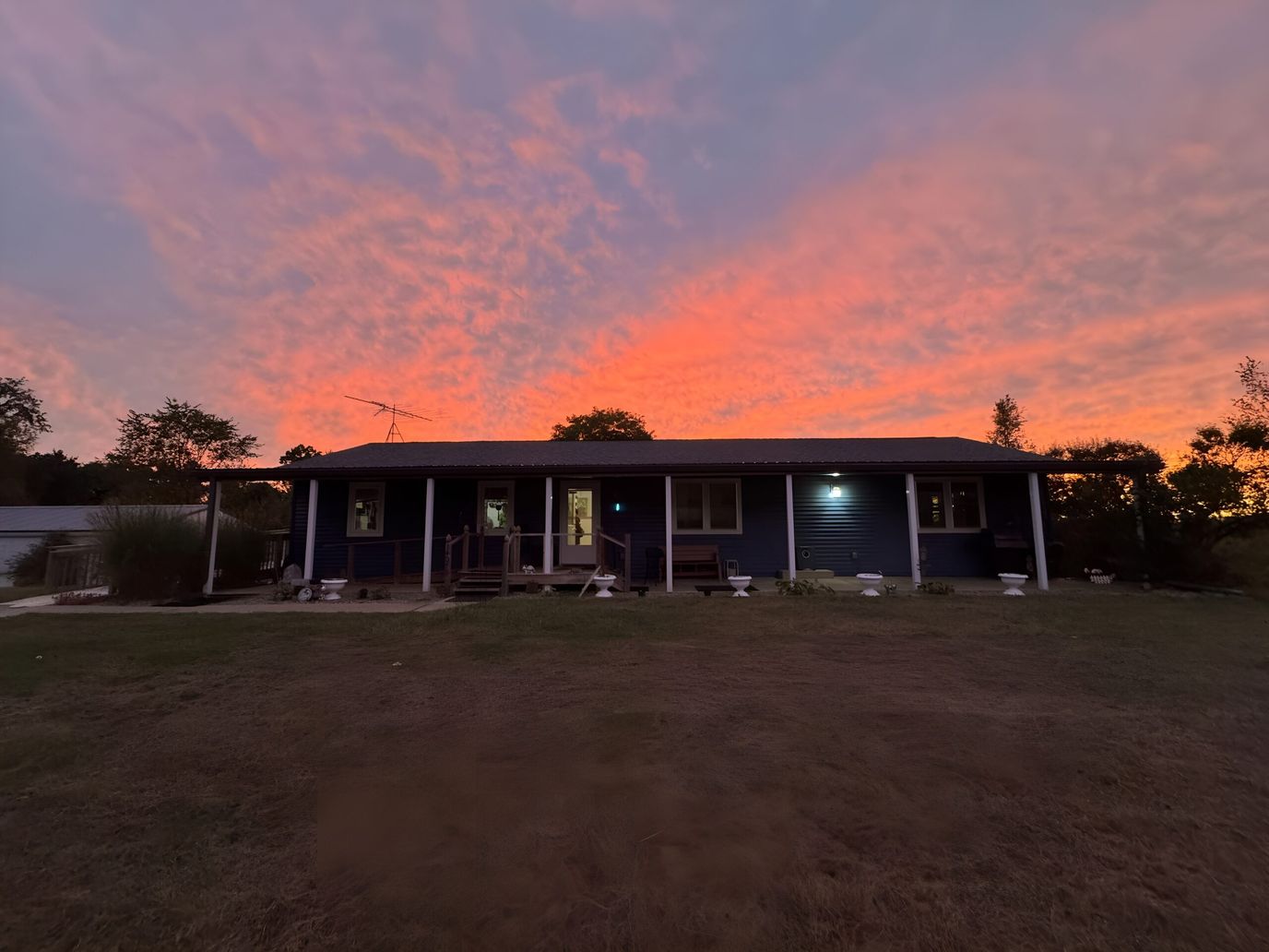 Exterior of a building at sunset with colorful sky