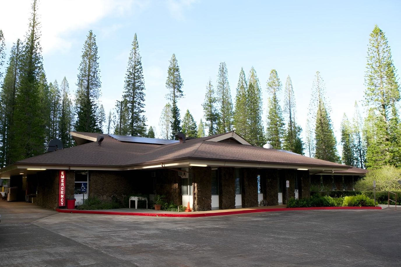 Exterior view of Lanai Community Hospital surrounded by trees