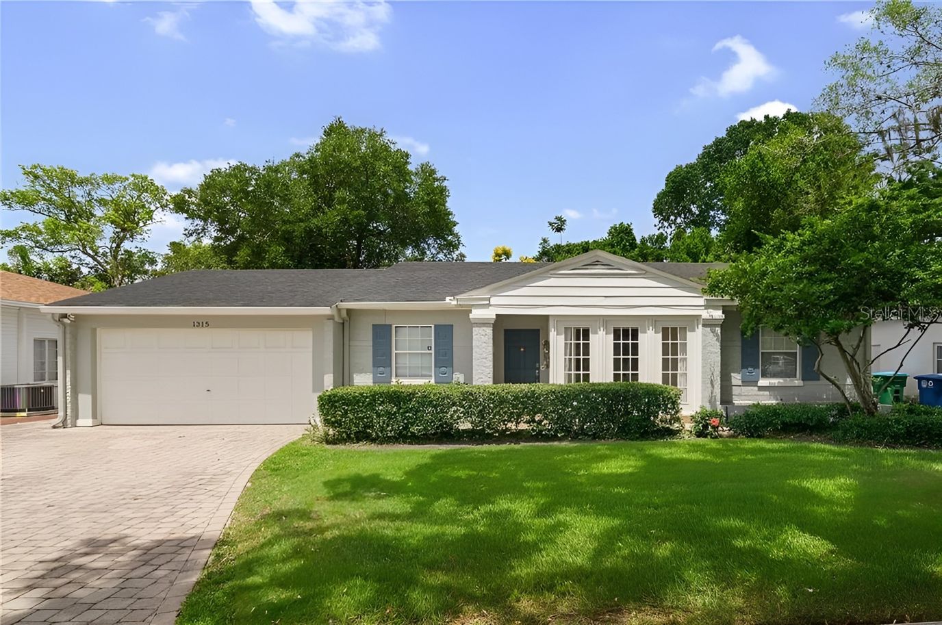Exterior view of a residential building with garden