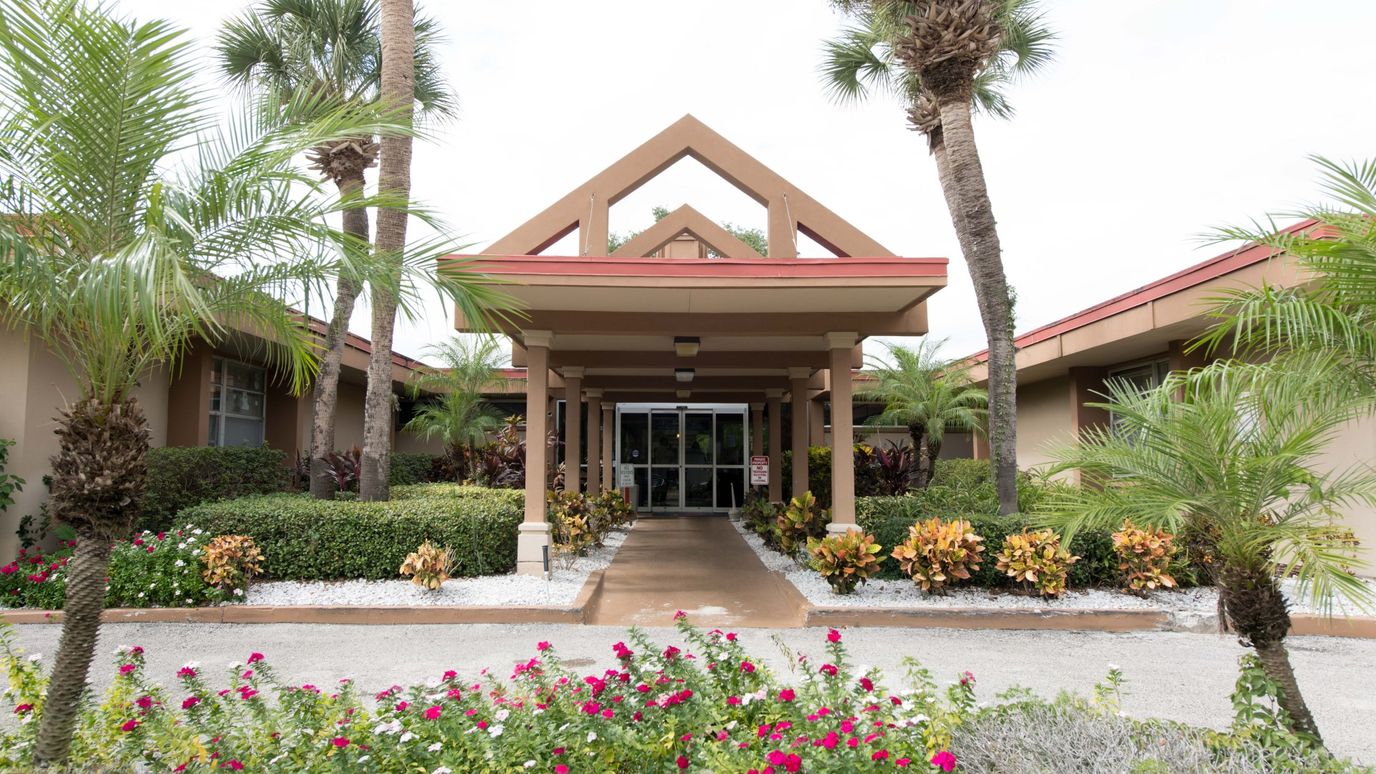 Entrance of South Orange Health and Rehabilitation Center surrounded by landscaping
