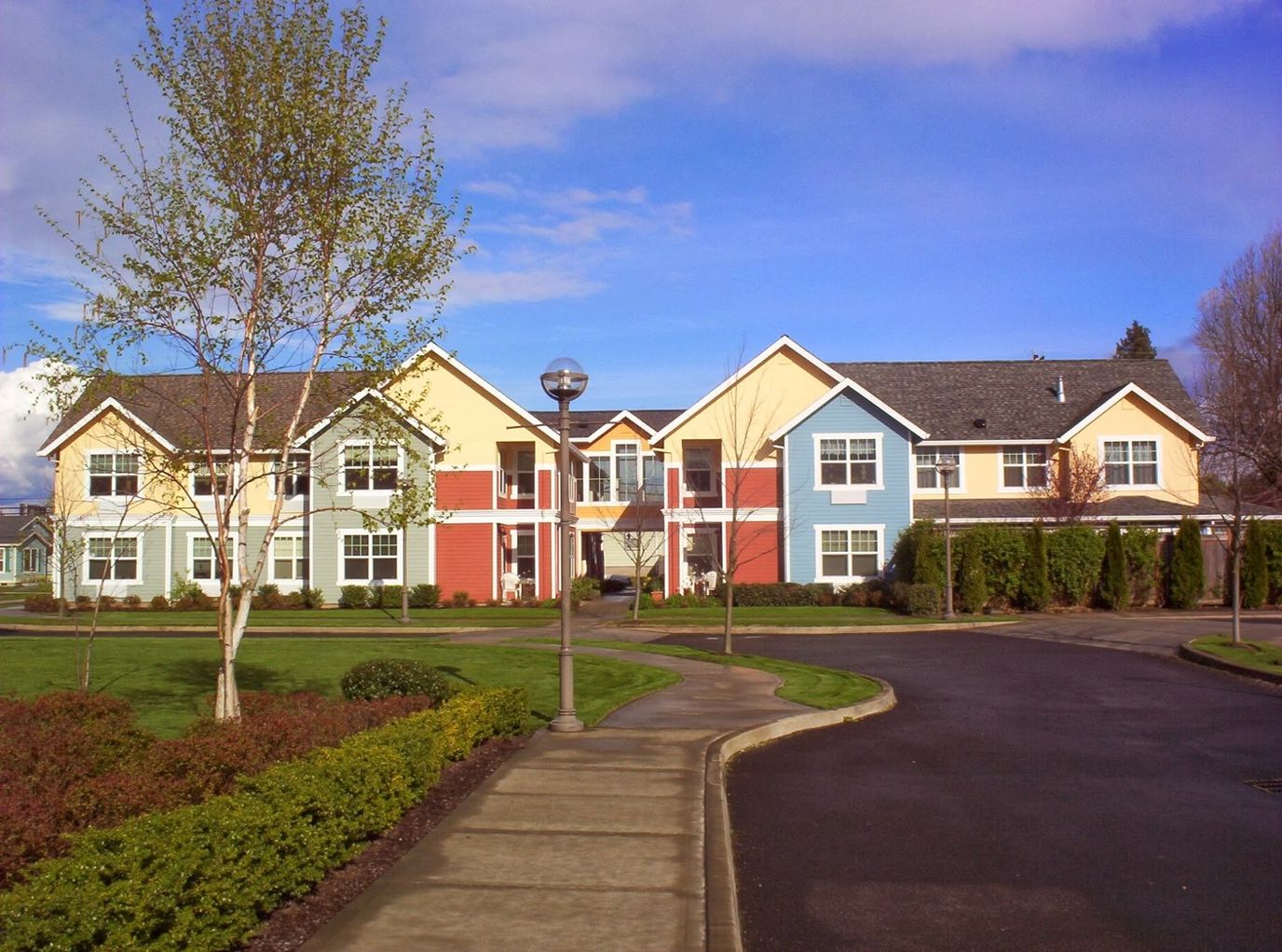 Exterior view of a colorful assisted living facility