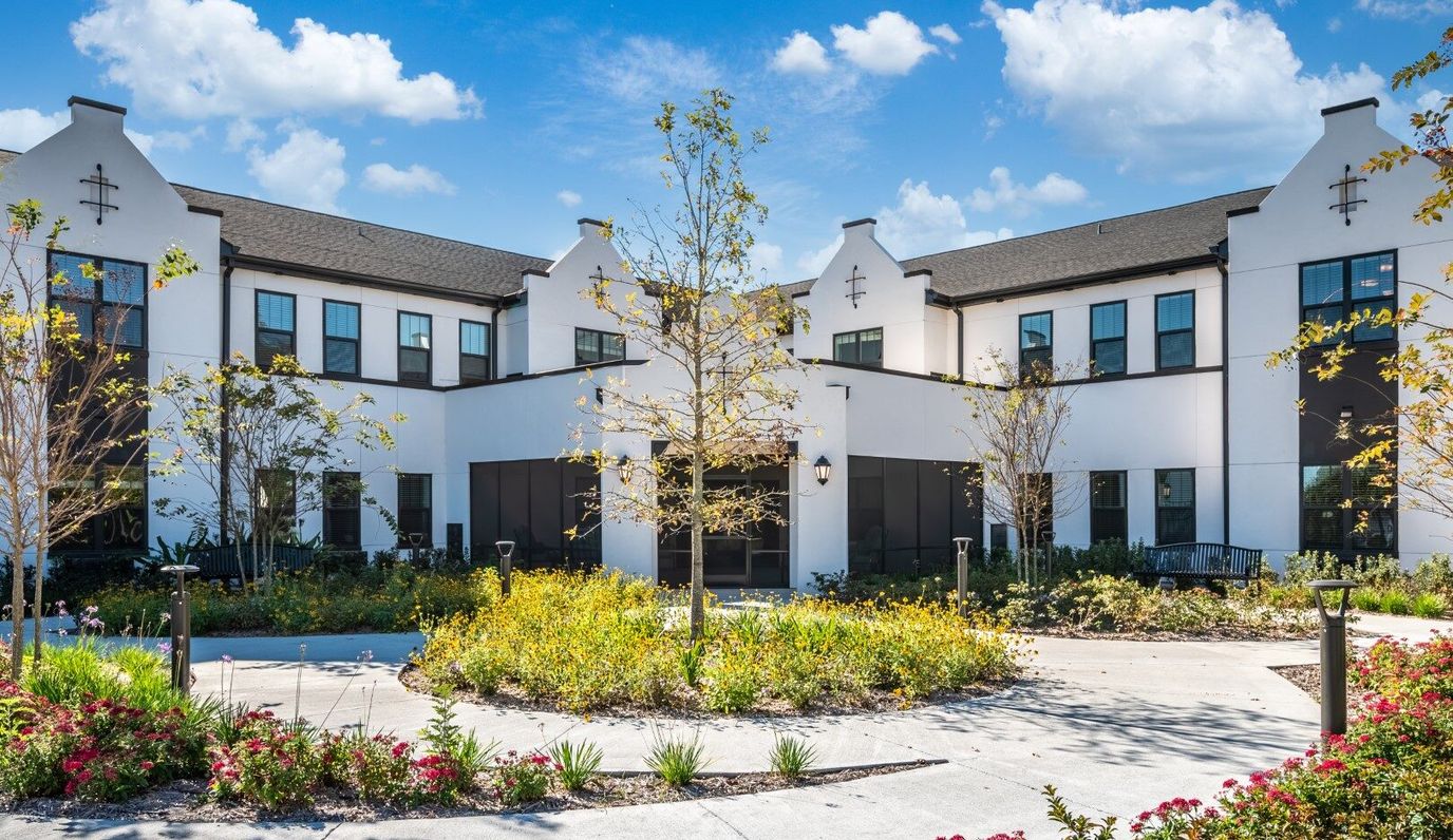 Exterior view of The Grove at Trelago with landscaping