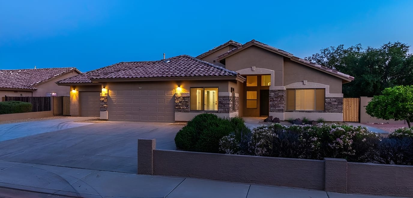Exterior view of a modern assisted living facility at dusk