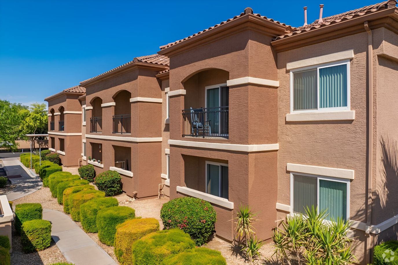 Exterior view of Deer Valley Gardens with landscaped walkway
