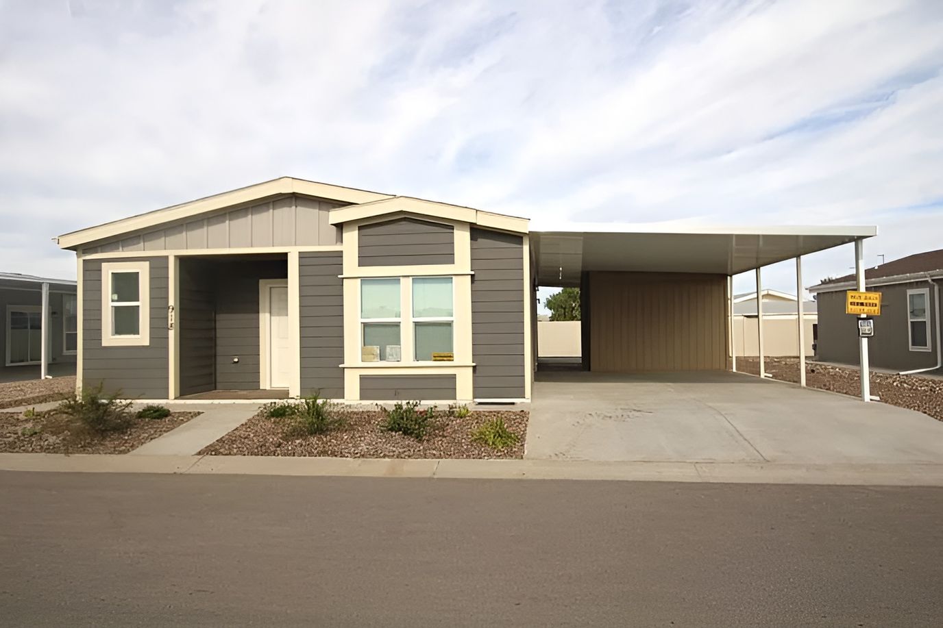 Exterior view of a facility building with a carport